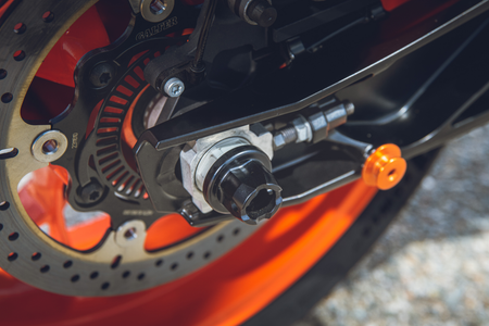 Close up of KTM Swingarm Slide Pad Kit in Black installed on bike