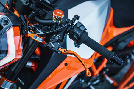 Installed photo of orange Folding Clutch Lever for 2020-2023 KTM 1290 Super Duke